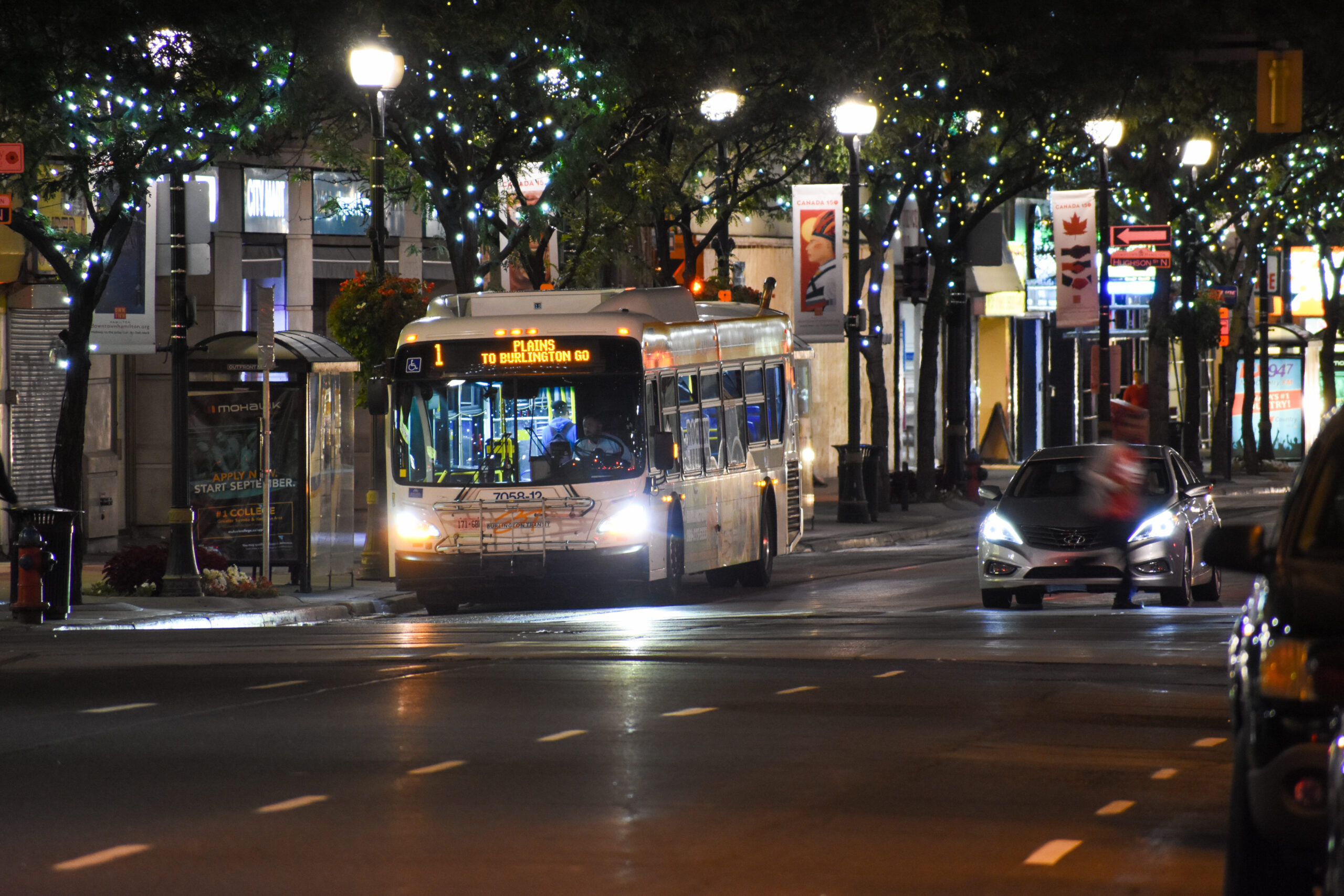 A Burlington Transit bus in Downtown Hamilton at night. Generic photo for illustrative purposes